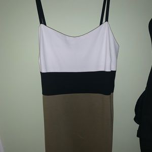 White, black and brown knees length dress.